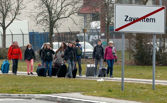 People leave the scene of explosions at Zaventem airport near Brussels, Belgium, March 22, 2016.    REUTERS/Francois Lenoir