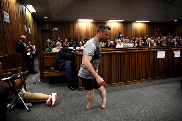 FILE PHOTO - Paralympic gold medalist Oscar Pistorius walks across the courtroom without his prosthetic legs during the third day of the resentencing hearing for the 2013 murder of his girlfriend Reeva Steenkamp, at Pretoria High Court, South Africa June 15, 2016. REUTERS/Siphiwe Sibeko/File Photo REUTERS PICTURES OF THE YEAR 2016 - SEARCH 'POY 2016' TO FIND ALL IMAGES