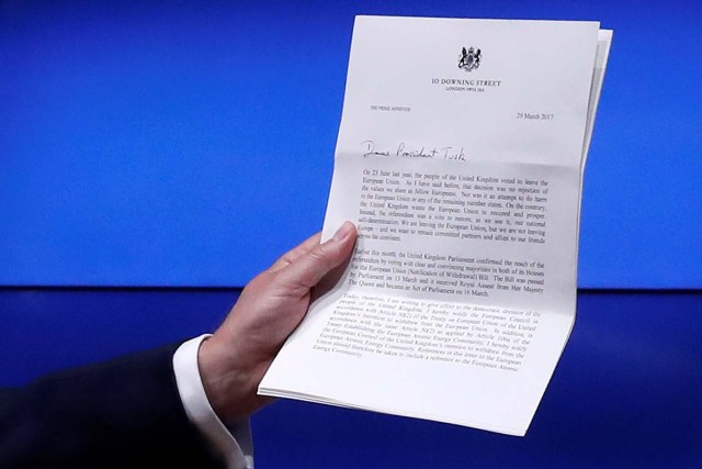 European Council President Donald Tusk shows British Prime Minister Theresa May's Brexit letter in notice of the UK's intention to leave the bloc under Article 50 of the EU's Lisbon Treaty, at the end of a news conference in Brussels, Belgium March 29, 2017. REUTERS/Yves Herman TPX IMAGES OF THE DAY