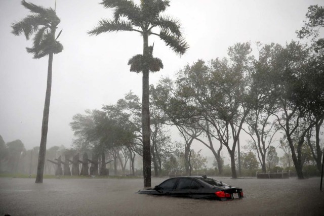 A partially submerged car is seen at a flooded area in Coconut Grove as Hurricane Irma arrives at south Florida, in Miami, Florida, U.S., September 10, 2017. REUTERS/Carlos Barria