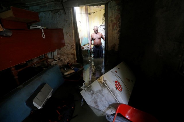 A man stands in his flooded home after the passing of Hurricane Irma in Havana, Cuba, September 10, 2017. REUTERS/Stringer NO SALES. NO ARCHIVES