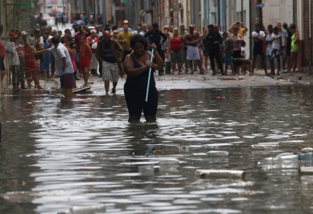 A woman wades through the water after the passing of Hurricane Irma, in Havana, Cuba September 10, 2017. REUTERS/Stringer NO SALES. NO ARCHIVES