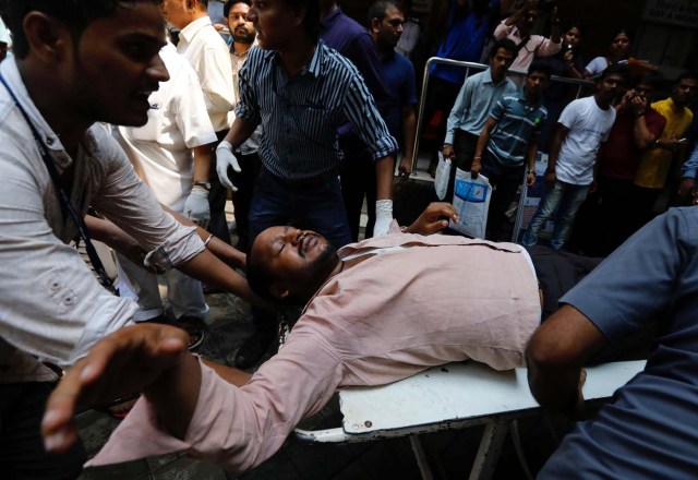 ATTENTION EDITORS - VISUAL COVERAGE OF SCENES OF DEATH AND INJURY A stampede victim is carried on a stretcher at a hospital in Mumbai, India September 29, 2017. REUTERS/Danish Siddiqui