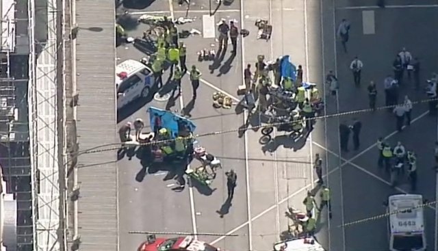 ATTENTION EDITORS - VISUAL COVERAGE OF SCENES OF INJURY OR DEATH Police and emergency services attend to the scene of an incident involving a vehicle on Flinders Street, as seen from Swanson Street, in Melbourne, Australia December 21, 2017. NINE NETWORK/Reuters TV via REUTERS ATTENTION EDITORS - THIS IMAGE WAS PROVIDED BY A THIRD PARTY. NO RESALES. NO ARCHIVE. AUSTRALIA OUT. NEW ZEALAND OUT. PAPUA NEW GUINEA OUT.
