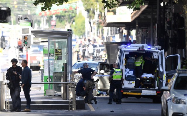 Police are seen at the scene of an incident on Flinders Street, in Melbourne, Australia December 21, 2017. AAP/Joe Castro via REUTERS ATTENTION EDITORS - THIS IMAGE WAS PROVIDED BY A THIRD PARTY. NO RESALES. NO ARCHIVE. AUSTRALIA OUT. NEW ZEALAND OUT.?