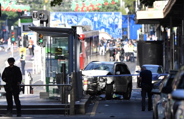 A damaged vehicle is seen at the scene of an incident on Flinders Street, in Melbourne, Australia December 21, 2017. AAP/Joe Castro via REUTERS ATTENTION EDITORS - THIS IMAGE WAS PROVIDED BY A THIRD PARTY. NO RESALES. NO ARCHIVE. AUSTRALIA OUT. NEW ZEALAND OUT.?