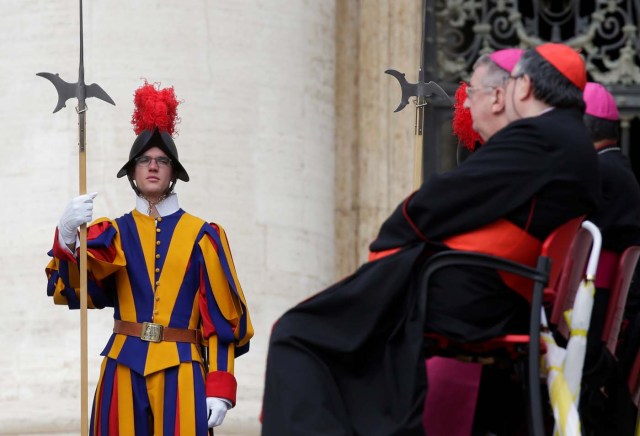 A Swiss guard stands during Pope Francis' Wednesday general audience in Saint Peter's square at the Vatican, April 18, 2018. REUTERS/Max Rossi
