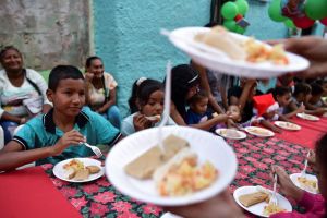 Venezuela’s working-class communities get together to eat Christmas ‘hallacas’